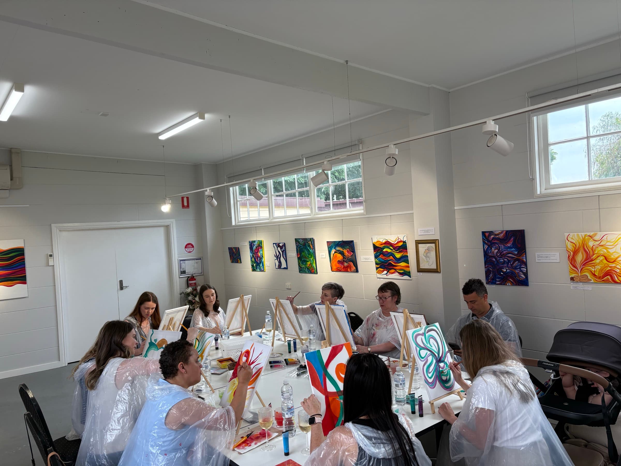 Participants painting during a guided workshop