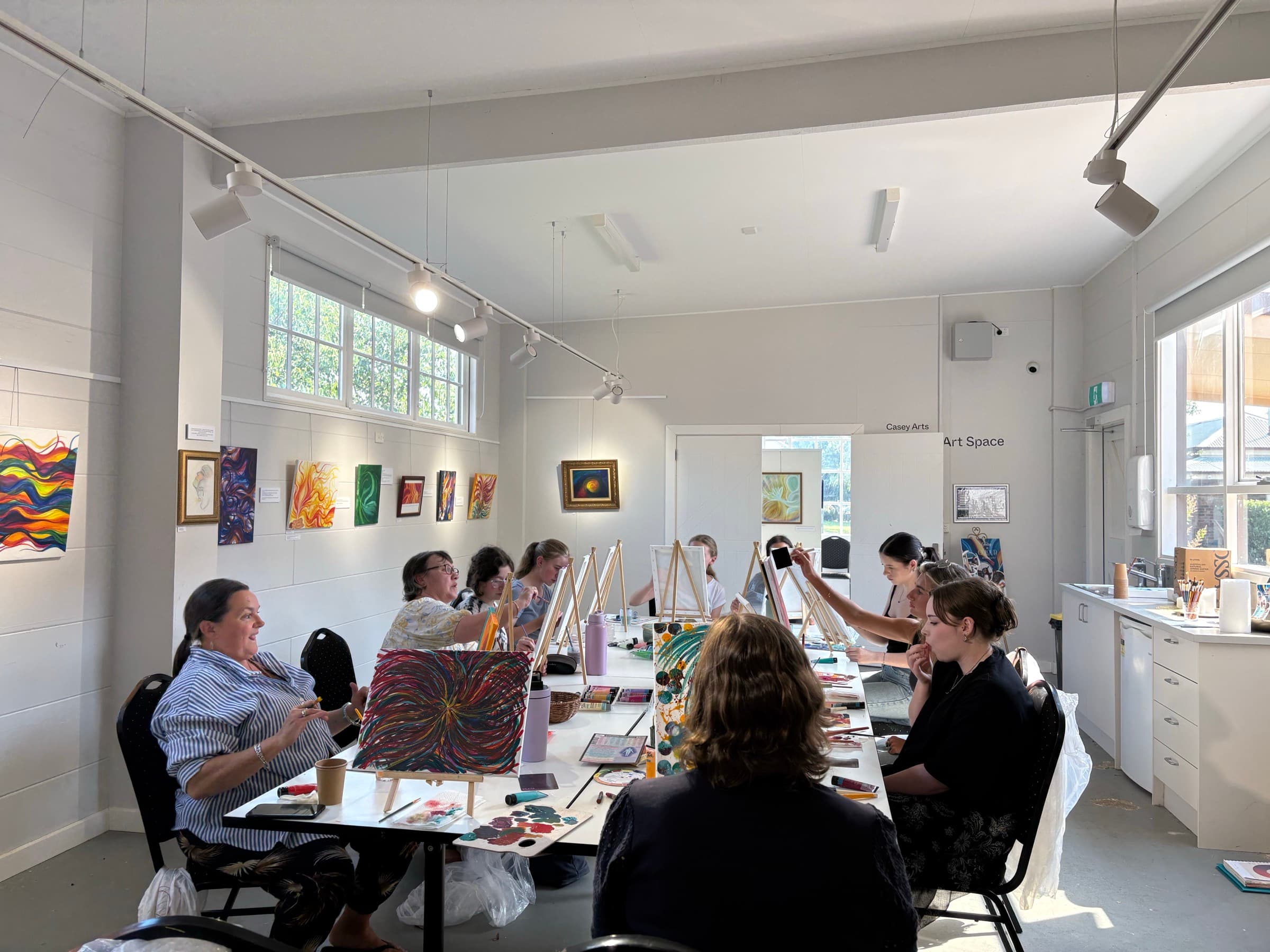 Workshop participants painting together